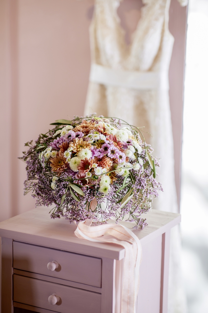 Bridal bouquet with colourful Chrys and purple Statice collar