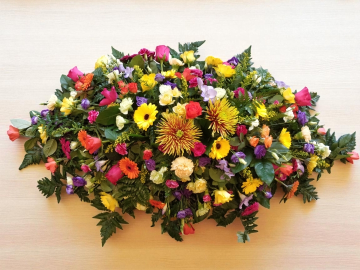 Vibrant Farewell Casket Spray