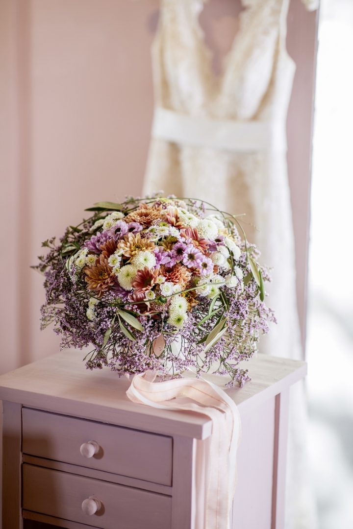 Bridal bouquet with colourful Chrys and purple Statice collar